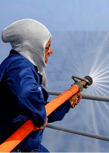 US Navy 081121-N-1082Z-062 Yeoman 1st Class Ella Dukes participates in hose team training
