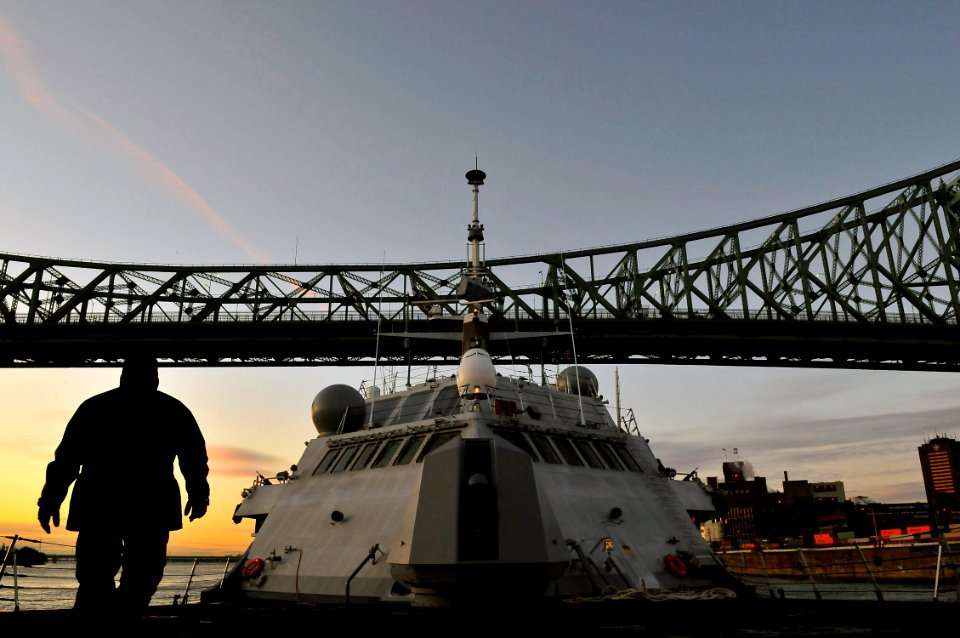 US Navy 081121-N-5758H-142 The littoral combat ship USS Freedom (LCS 1) sails under the Pont Jacques-Cartier Bridge as the ship departs from the Old Port of Montreal photo