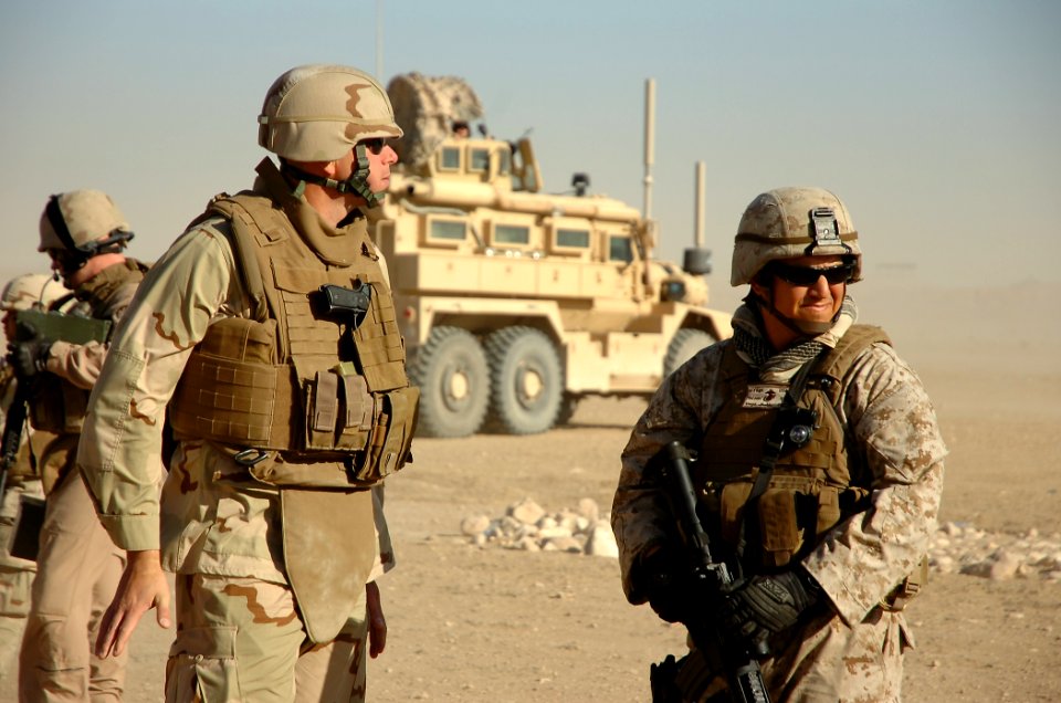 US Navy 101001-N-6436W-006 Gunnery Sgt. Javier Vega, right, and Cmdr. Tim DeWitt, commanding officer of Naval Mobile Construction Battalion (NMCB)