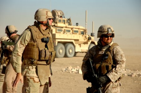 US Navy 101001-N-6436W-006 Gunnery Sgt. Javier Vega, right, and Cmdr. Tim DeWitt, commanding officer of Naval Mobile Construction Battalion (NMCB)