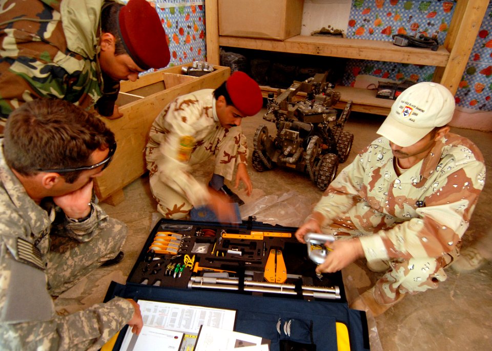 US Navy 081126-N-6278K-001 Explosive Ordnance Disposal Technician 1st Class Neil Marshall, assigned to Explosive Ordnance Disposal Mobile Unit (EODMU) 1, inspects the Iraqi Army Bomb Disposal Company's hook and line kit in Tikr