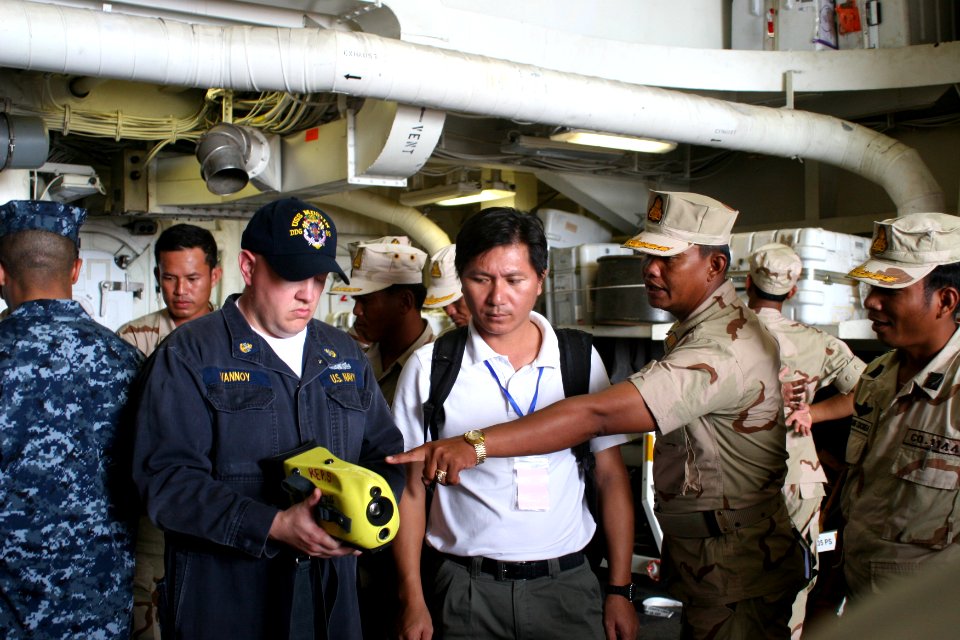 US Navy 101204-N-4780J-096 Chief Engineman Jason Vannoy discusses the use of the Naval Firefighting Thermal Imager (NFTI), an infrared camera used
