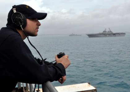 US Navy 100905-N-3620B-035 Machinist's Mate Fireman Joseph M. Gambino stands lookout watch aboard USS Denver (LPD 9)