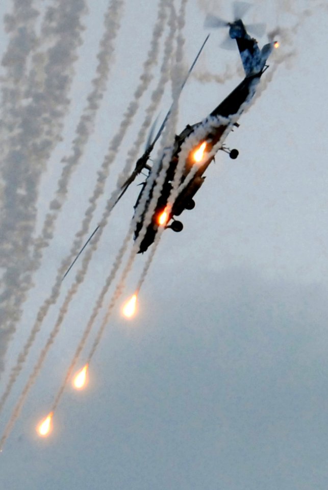 US Navy 081121-N-7730P-283 An HH-60H Sea Hawk assigned to HS-4 displays the ability to launch flares and quickly maneuver out of vulnerability during an air power demonstration on the flight deck of USS Ronald Reagan (CVN 76)