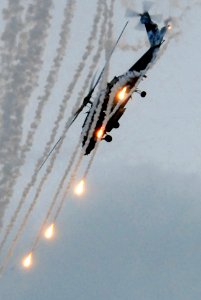 US Navy 081121-N-7730P-283 An HH-60H Sea Hawk assigned to HS-4 displays the ability to launch flares and quickly maneuver out of vulnerability during an air power demonstration on the flight deck of USS Ronald Reagan (CVN 76)