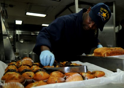 US Navy 101018-N-5016P-011 Culinary Specialist 3rd Class Tony Parker prepares breakfast aboard the guided-missile cruiser USS Cape St. George (CG 7 photo