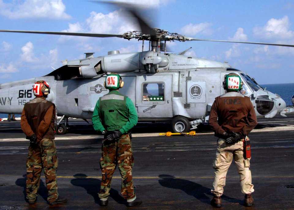 US Navy 081127-N-8822R-220 Army Gen. David H. Patraeus departs the flight deck of the Nimitz-class aircraft carrier USS Theodore Roosevelt (CVN 71)