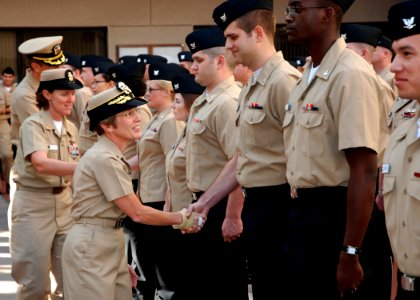 US Navy 081203-N-6326B-204 Rear Adm. Christine S. Hunter, Commander, Naval Medical Center San Diego, congratulates Sailors after a frocking ceremony promoting166 Sailors at the command