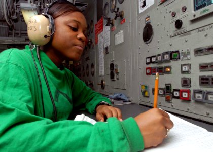 US Navy 081130-N-2456S-066 Aviation Boatswain's Mate (Equipment) Airman Ariell Ward logs aircraft that have been launched