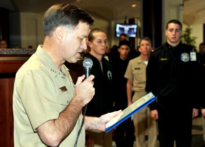 US Navy 081203-N-5390M-002 Vice Adm. Mark E. Ferguson reads a Meritorious Unit Commendation citation to the Brigade of Midshipmen