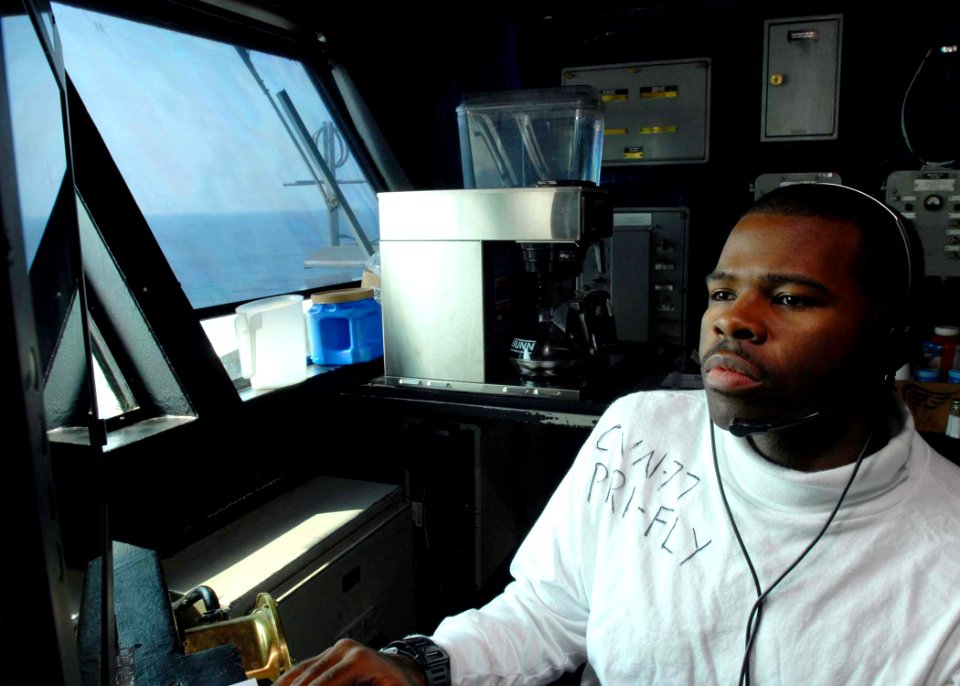 US Navy 081126-N-2456S-023 Aviation Boatswain's Mate (Handling) Airman Apprentice Jamire Wimberly, assigned to the aircraft carrier USS George H. W. Bush (CVN 77), monitors flight operations