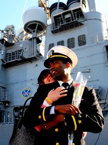 US Navy 081203-N-5345W-123 Ensign Jason Burroughs and his wife Kelli share a tender moment