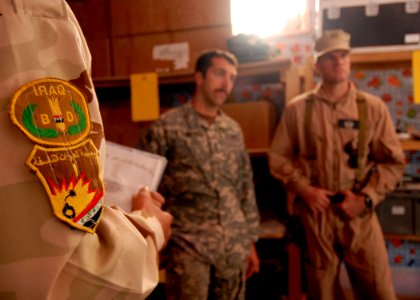 US Navy 081126-N-6278K-003 Explosive Ordnance Disposal Technician 1st Class Neil Marshall, left, and Lt. Brian Ross, both assigned to Explosive Ordnance Disposal Mobile Unit (EODMU) 1