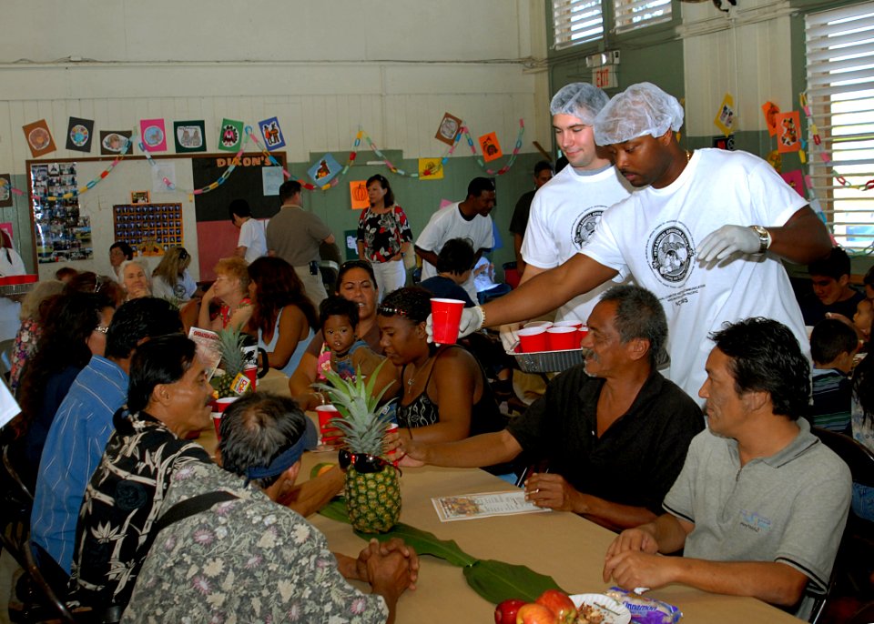 US Navy 081127-N-5476H-013 nformation Technician 2nd Class Brandon Hayes serves beverages during the 19th annual Operation Aloha