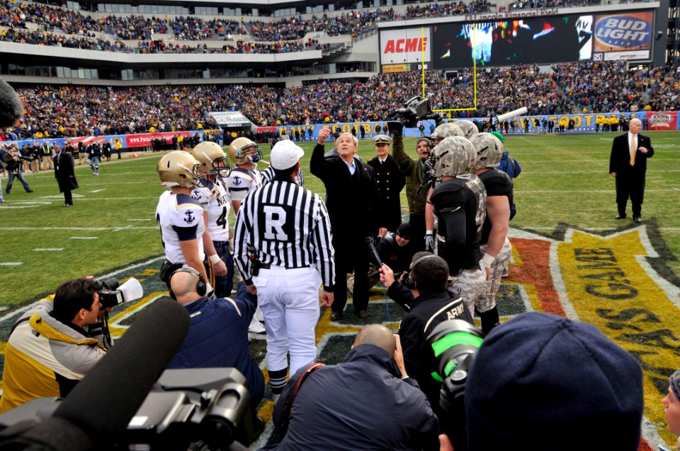 US Navy 081206-N-4565G-255 President George W. Bush conducts the ceremonial coin toss before the start of the 109th Army-Navy college football game at Lincoln Financial Field in Philadelphia
