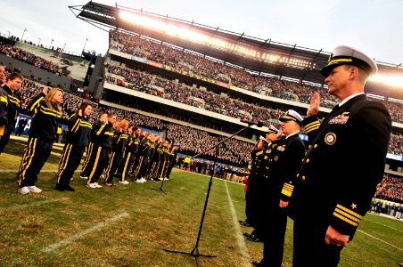US Navy 101211-N-8273J-292 Chief of Naval Operations (CNO) Adm. Gary Roughead, second to the right, administers the oath of enlistment to recruits photo