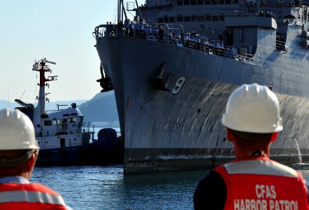 US Navy 081202-N-0807W-119 Sailors man the rails as the Austin-class amphibious transport dock ship USS Denver (LPD 9) returns to Fleet Activities Sasebo