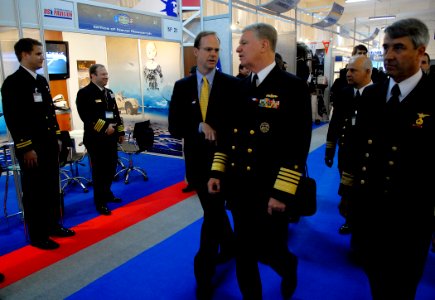 US Navy 081202-N-7676W-101 Chief of Naval Operations Adm. Gary Roughhead along with Paul Simons, pass the Office of Naval Research Global (ONRG) booth while visiting EXPONAVAL 2008