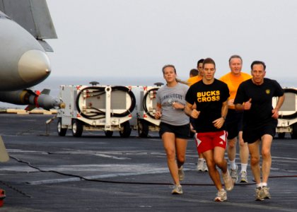 US Navy 081127-N-8822R-020 Gen. David H. Patraeus, Commander, United States Central Command (CENTCOM), right, and Sailors aboard the aircraft carrier USS Theodore Roosevelt (CVN 71) go for a morning jog