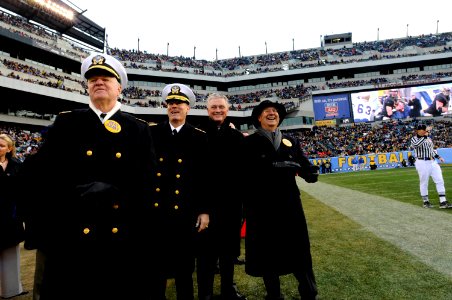 US Navy 081206-N-8273J-386 Chief of Naval Operations Adm. Gary Roughead and Secretary of the Navy the Honorable Donald C. Winter cheer from the sidelines during the 109th annual Army-Navy football game photo