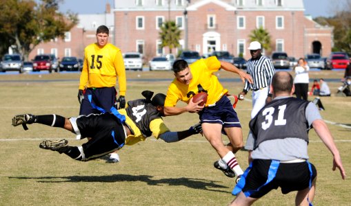 US Navy 081206-N-5328N-399 Navy quarterback Marine Corps Staff Sgt. Trevor Claypool runs through the Army defense during the 6th annual Army-Navy flag football game