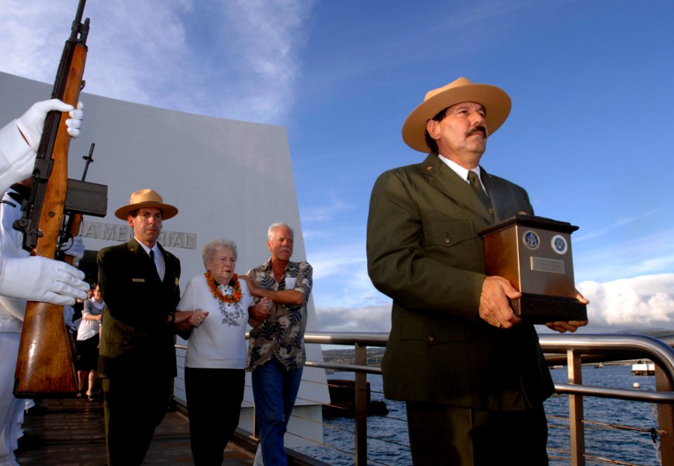 US Navy 081207-N-0535P-241 Daniel Martinez, historian for the National Park Service at the USS Arizona Memorial, walks with the cremains of Seaman 1st Class Charles Guerin Jr. during an interment ceremony at the USS Arizona Mem