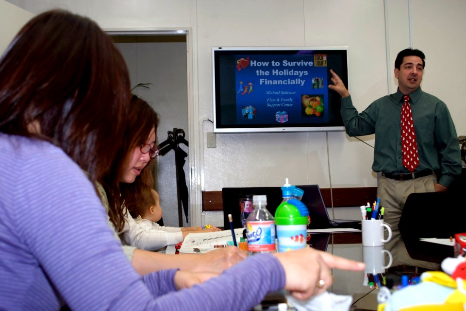 US Navy 081203-N-9123L-001 Michael Spiltener gives a presentation on responsible holiday spending to members of the community