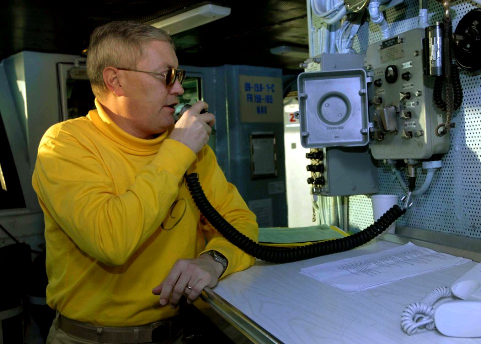 US Navy 081204-N-8822R-078 Capt. Ladd Wheeler, commanding officer of the aircraft carrier USS Theodore Roosevelt (CVN 71), makes an announcement over the ship's general announcement system