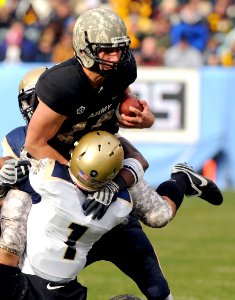 US Navy 081206-N-4565G-780 U.S. Military Academy quarterback Chip Bowden is sacked by U.S. Naval Academy Midshipmen during 109th Army-Navy college football game at Lincoln Financial Field in Philadelphia