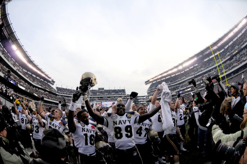 US Navy 081206-N-4565G-983 The US Naval Academy Midshipmen run off the field after beating the US Military Academy Black Knights 34-0 in the 109th Army-Navy college football game (Lincoln Financial Field, Philadelphia)