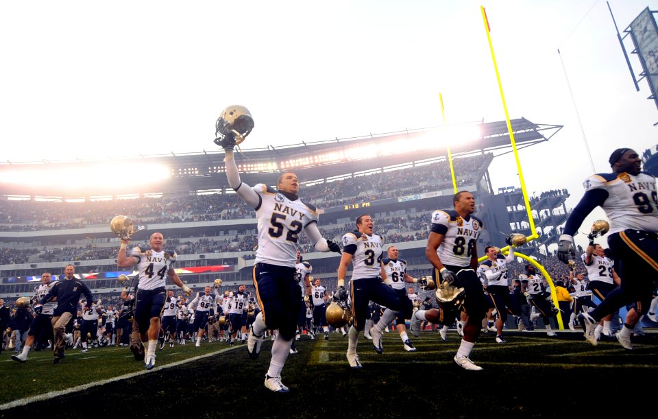 US Navy 081206-N-5345W-764 The U.S. Naval Academy Midshipmen run off the filed after beating the U.S. Military Academy Black Knights 34 to 0