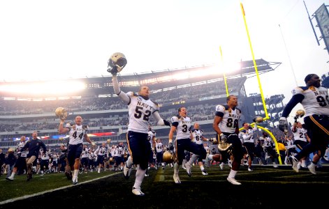 US Navy 081206-N-5345W-764 The U.S. Naval Academy Midshipmen run off the filed after beating the U.S. Military Academy Black Knights 34 to 0