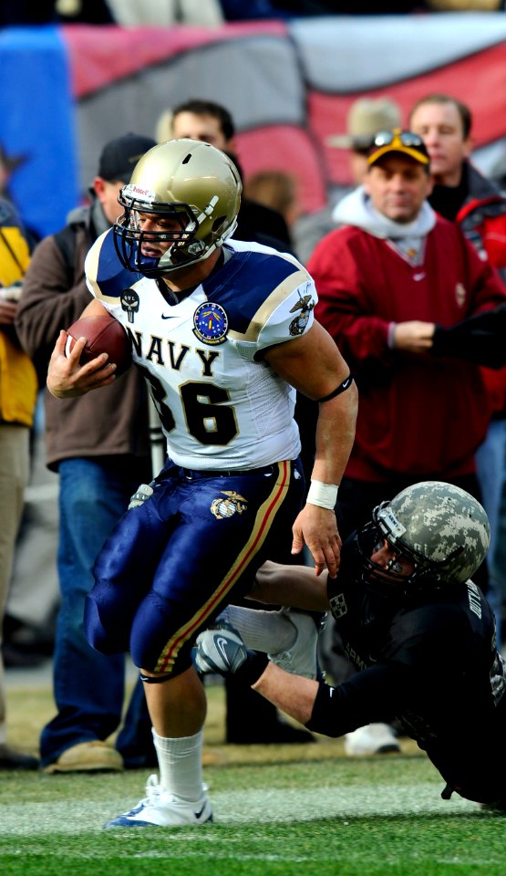 US Navy 081206-N-6266K-958 U.S. Naval Academy fullback Eric Kettani (^36) gets past an a U.S. Military defender during first half of the 109th Army-Navy college football game at Lincoln Financial Field in Philadelphia
