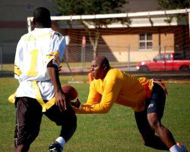 US Navy 081206-N-8390S-313 Aviation Machinist's Mate 1st Class Shannon Hill intercepts the ball during an Army-Navy Recruiters flag football game