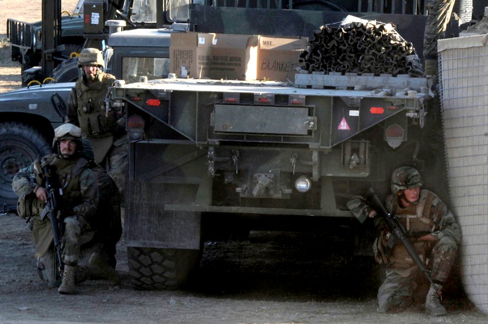 US Navy 081210-N-9584N-176 Seabees from Naval Mobile Construction Battalion (NMCB) 5 take cover during a simulated vehicle improvised explosive device attack at Fort Hunter Liggett