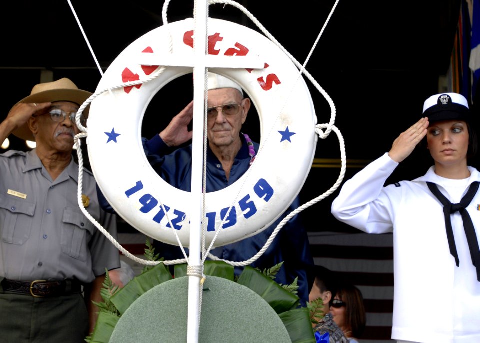 US Navy 081207-N-0535P-126 A survivor of the attack on Pearl Harbor in 1941 renders honors as a wreath is displayed during a joint U.S. Navy-National Park Service ceremony commemorating the 67th anniversary of the attack on Pea