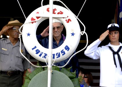 US Navy 081207-N-0535P-126 A survivor of the attack on Pearl Harbor in 1941 renders honors as a wreath is displayed during a joint U.S. Navy-National Park Service ceremony commemorating the 67th anniversary of the attack on Pea