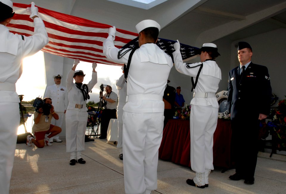 US Navy 081207-N-0535P-279 The Navy Region Hawaii Ceremonial Guard fold an American flag during an interment ceremony for Seaman 1st Class Charles Guerin Jr.