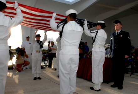 US Navy 081207-N-0535P-279 The Navy Region Hawaii Ceremonial Guard fold an American flag during an interment ceremony for Seaman 1st Class Charles Guerin Jr.