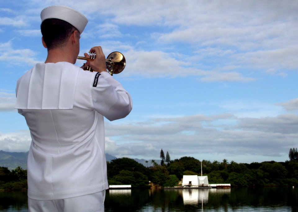 US Navy 081207-N-0879R-004 A Sailor plays taps during a joint U.S. Navy-National Park Service ceremony commemorating the 67th anniversary of the attack on Pearl Harbor