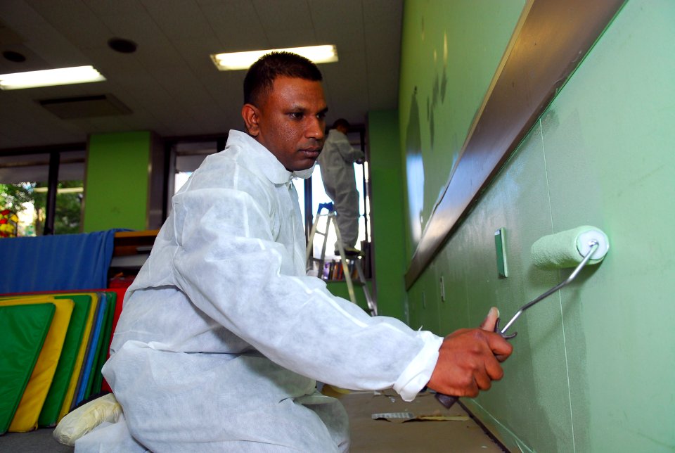 US Navy 081207-N-2013O-008 Electrician's Mate 3rd Class Gyanand Sookham paints a classroom during a community relations project at the Tokyo YMCA