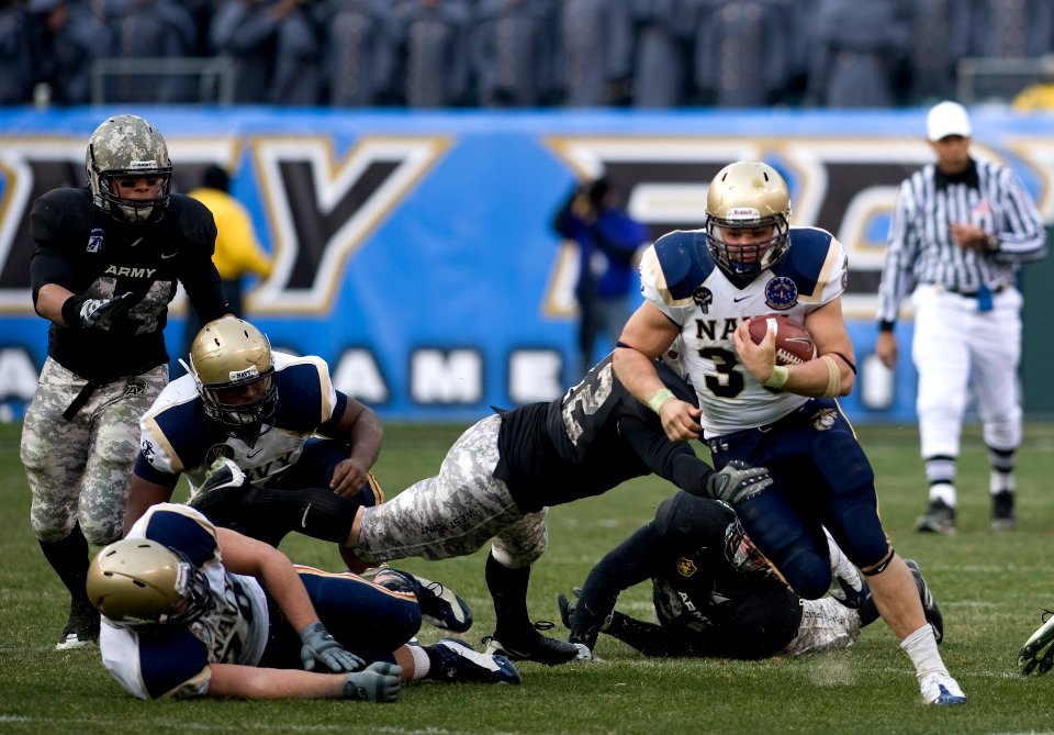 US Navy 081206-N-0696M-167 The U.S. Naval Academy fullback Eric Kettani runs for a first down during the 109th playing of the Army-Navy football game at Lincoln Financial Field in Philadelphia