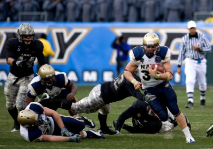 US Navy 081206-N-0696M-167 The U.S. Naval Academy fullback Eric Kettani runs for a first down during the 109th playing of the Army-Navy football game at Lincoln Financial Field in Philadelphia