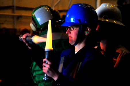 US Navy 081206-N-4774B-601 Interior Communications Electrician 3rd Class Shawna Clark directs amphibious assault vehicles