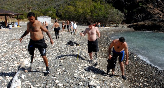 US Navy 081207-N-9769P-168 njured service members participate in a beach cleanup at Blue Beach in Guantanamo Bay during their dive certification trip as part of the Soldiers Undertaking Disabled Scuba (SUDS) program