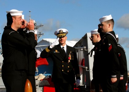 US Navy 081212-N-7668G-071 Cmdr. John Kropcho III departs the Los Angeles attack submarine USS Jacksonville (SSN 699) at the end of his 24-year Navy career
