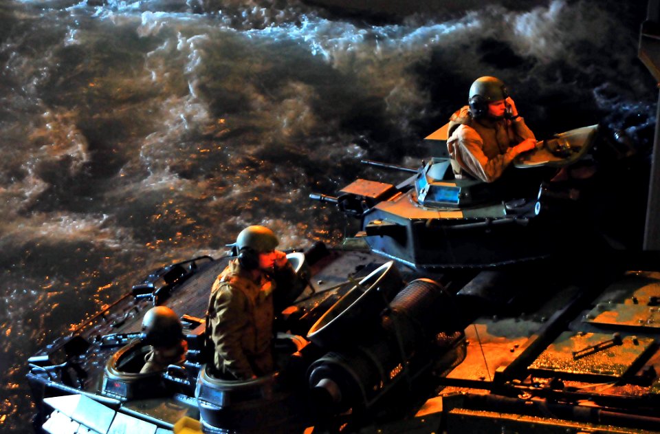 US Navy 081206-N-4774B-625 Amphibious assault vehicles head into the well deck of amphibious transport dock ship USS New Orleans (LPD 18)