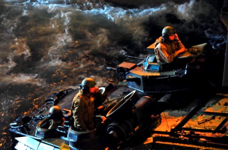 US Navy 081206-N-4774B-625 Amphibious assault vehicles head into the well deck of amphibious transport dock ship USS New Orleans (LPD 18)