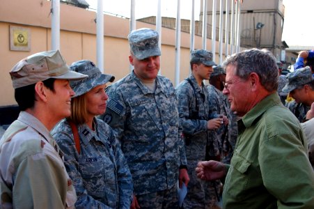 US Navy 081206-N-6708W-020 Sen. James Inhofe, R-Okla., meets Chief Petty Officer Susan Hammond, Air Force Capt. Jutta Arkan and Army Staff Sgt. Alan Luppy