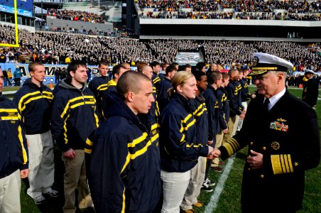 US Navy 081206-N-8273J-253 Chief of Naval Operations Adm. Gary Roughead congratulates new Navy recruits who enlisted during the 109th annual Army-Navy football game photo